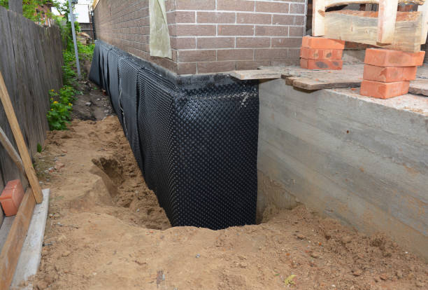 Happy homeowners after waterproofing job in Dunkirk